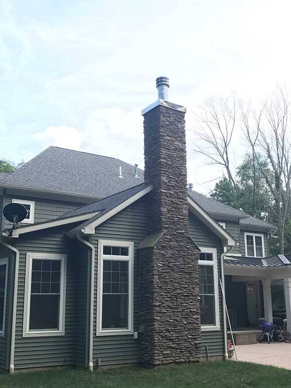 Stone Chimney with Chimney Chase Cover - Lackawanna County PA - Integrity Chimney Service