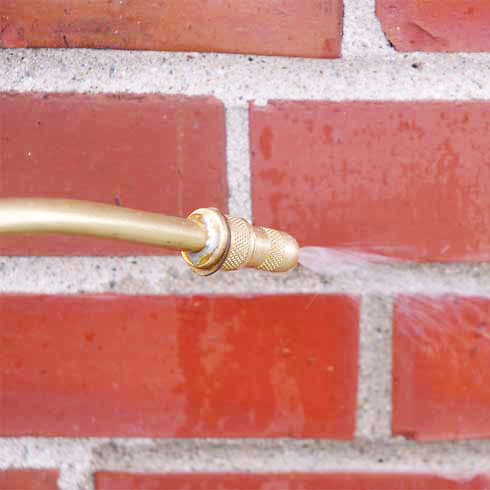 Water repellent sprayer spraying bricks