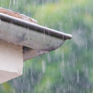 rain falling down on some home gutters